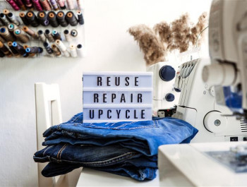 reuse-repair-upcycle-text-on-light-board-on-sewi-2025-03-12-21-34-53-utc_main