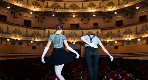 rear-view-two-performer-bowing-stage-1-_main