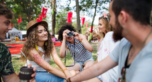 group-of-young-friends-sitting-on-ground-at-summer-2023-11-27-05-31-53-utc-scaled_main