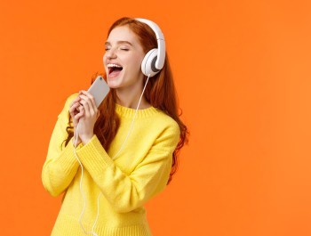 girl-carried-away-while-listen-favorite-track-pretty-redhead-female-enjoy-music-new-headphones-pa_main